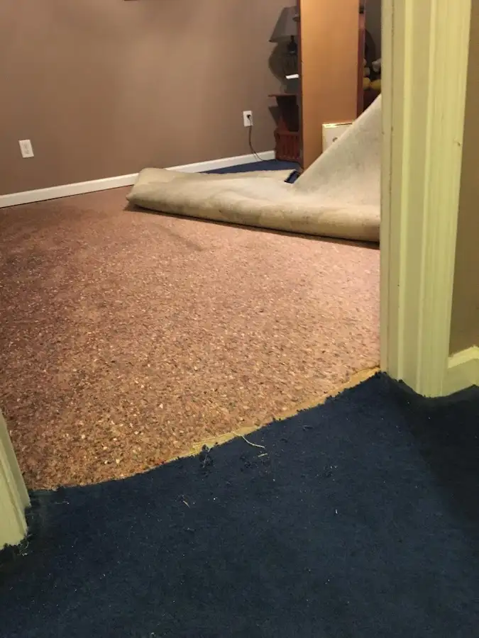 Carpet pad removal revealing water damage during Drying & Dehumidification in Rincon